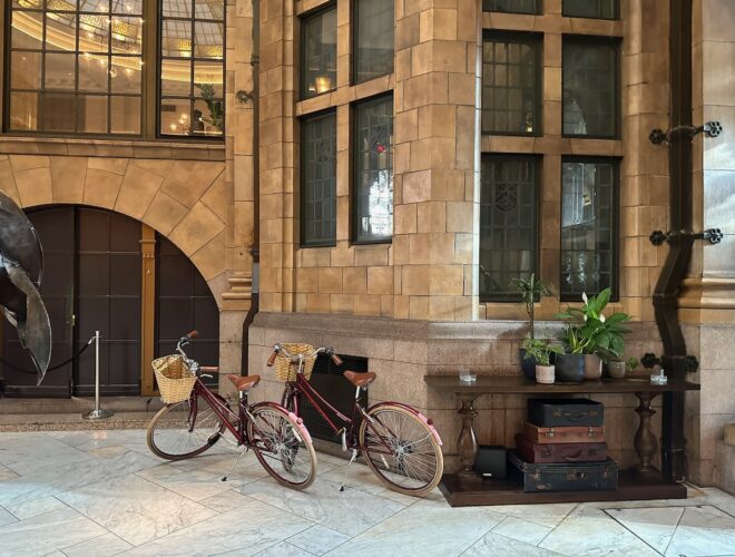 Two bicycles in the marble lobby of the Kimpton Clocktower Hotel.