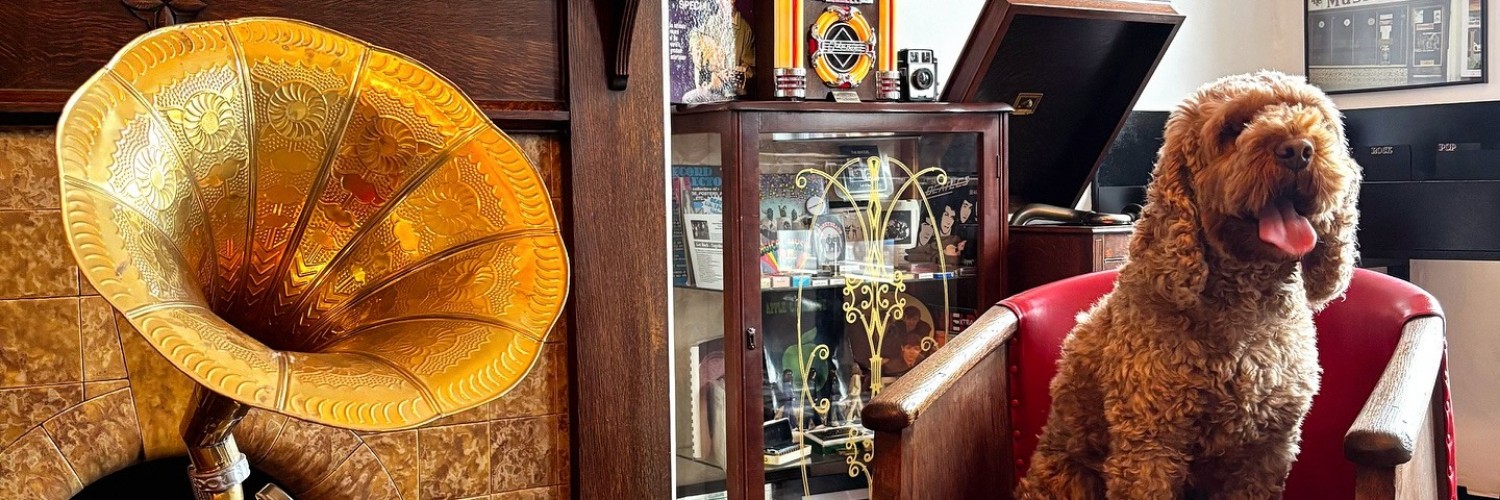 A giant gramophone and a small dog at The Musical Box