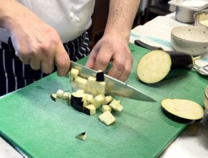Chef dicing aubergine