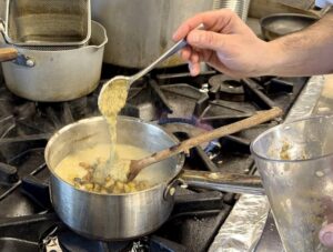 Adding aubergine puree to risotto