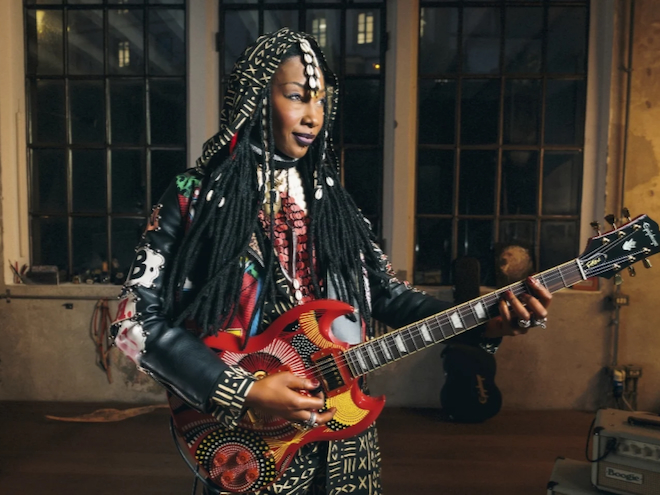 Grammy nominated Fatoumata Diawara playing her guitar.