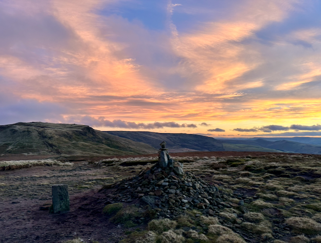 Looking towards Kinder Scout from Mill Hill in the Peak District at sunset.
