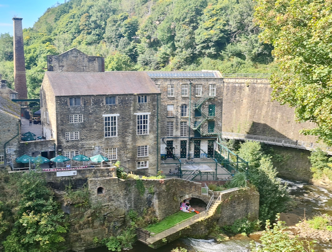 Torr Vale Mill and the Millennium Walkway in New Mills.