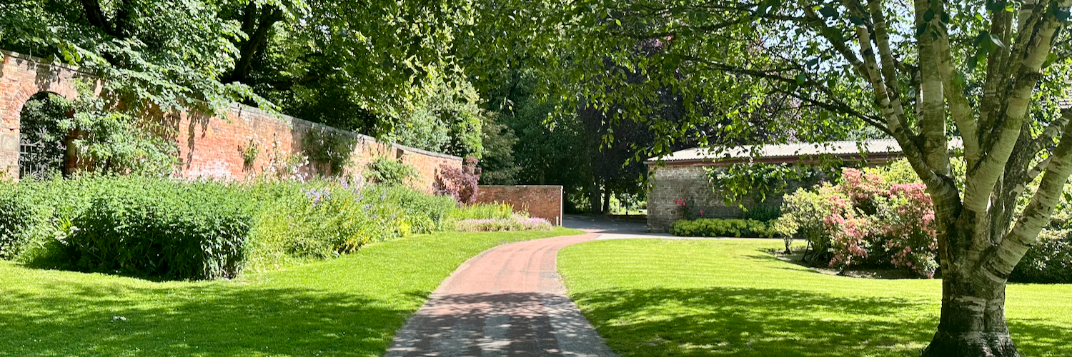 The walled garden at Manor Park in Glossop on a sunny day.