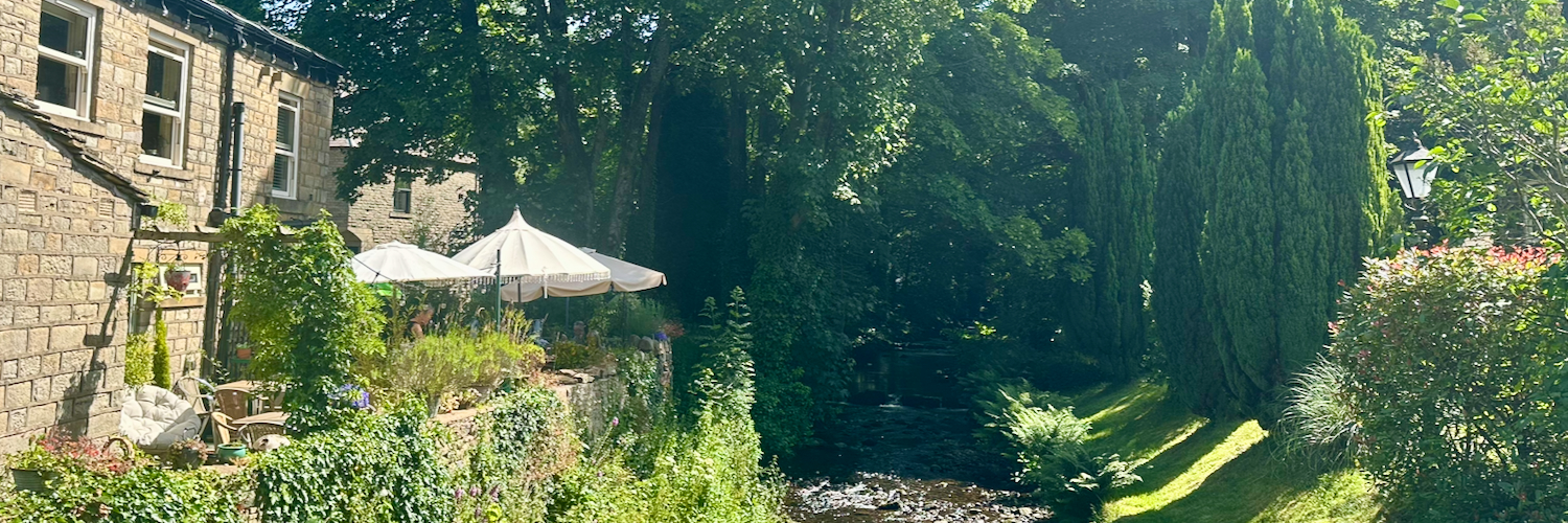 Looking towards the terrace by the river at Shepley's Cafe in Glossop.