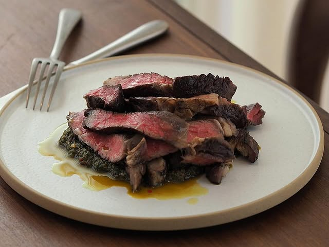 Strips of medium-rare ribeye steak with mojo verde at Pilgrim, Liverpool.