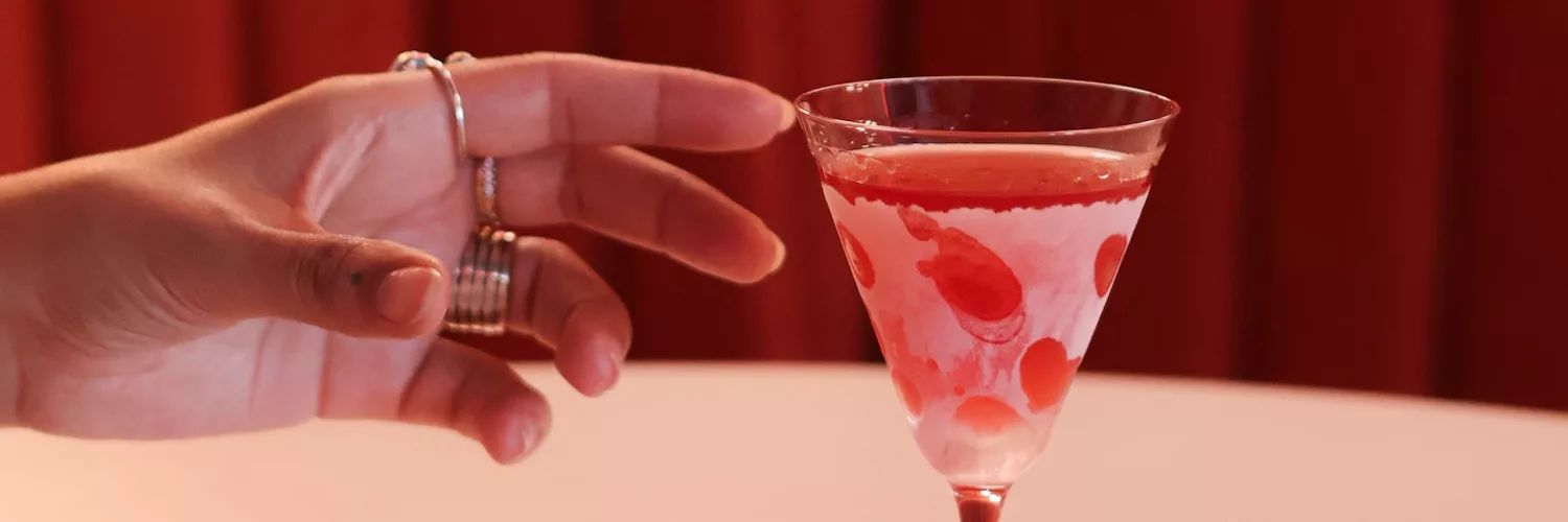 A hand reaching for a frozen martini at The Morris in Manchester.