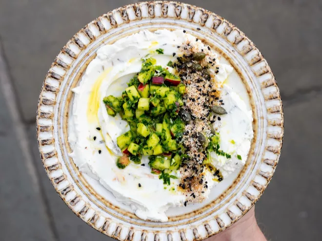 Whipped goat’s cheese, pickled apple gremolata, and coconut dukkah at Maray in Manchester.