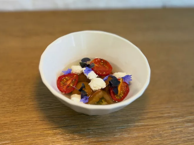 Tomatoes with basil, cornflowers and tomato essence at Vetch in Liverpool.