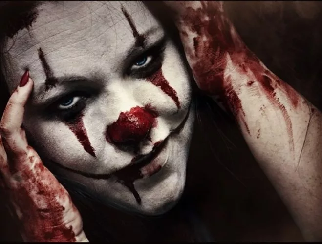 Blood-spattered clown at Farm of Terror