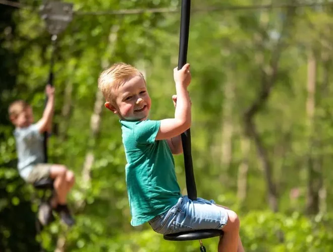 Children on a zip wire at BeWILDerwood Cheshire