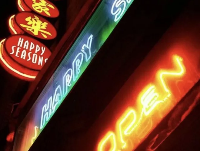 Neon signage outside Happy Seasons