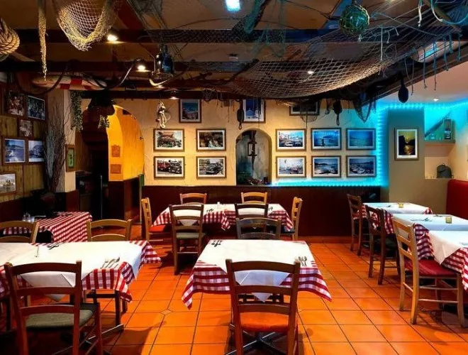 Interior of Dimitri's with red and white checked tablecloths